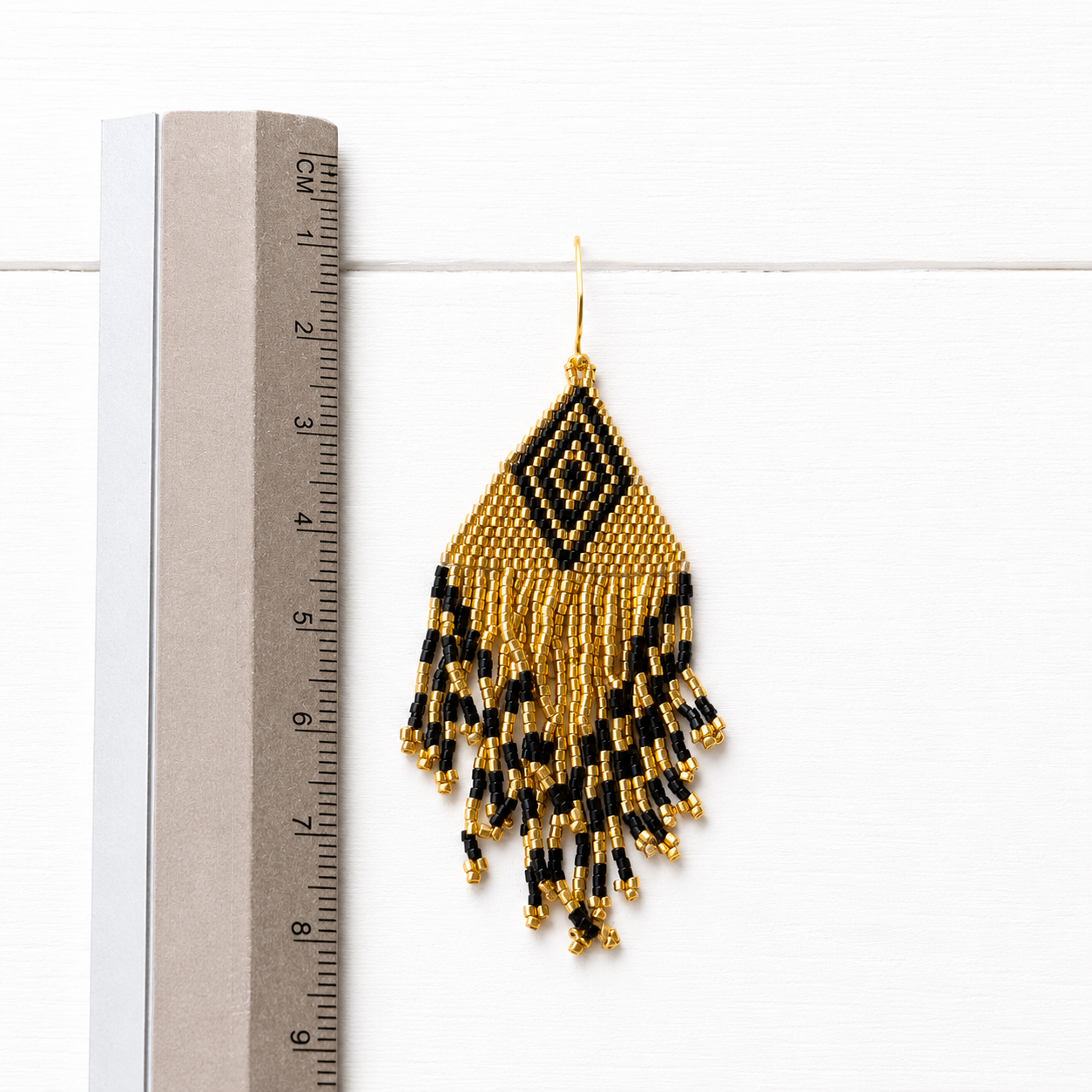 Pendientes miyuki rombo dorados y negro
