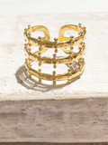 Anillo acero dorado corona tres filas