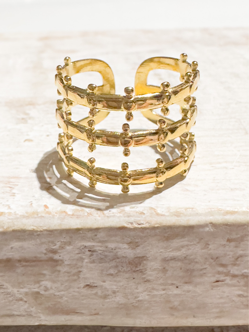 Anillo acero dorado corona tres filas