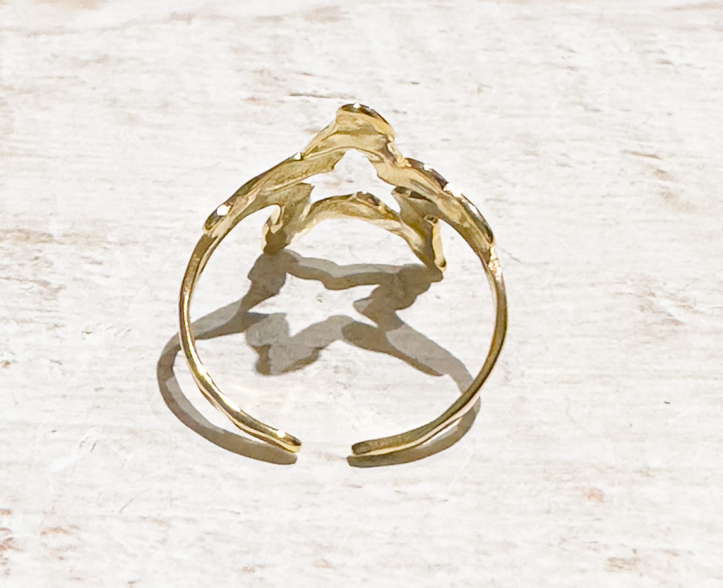 Anillo acero dorado estrella hueca
