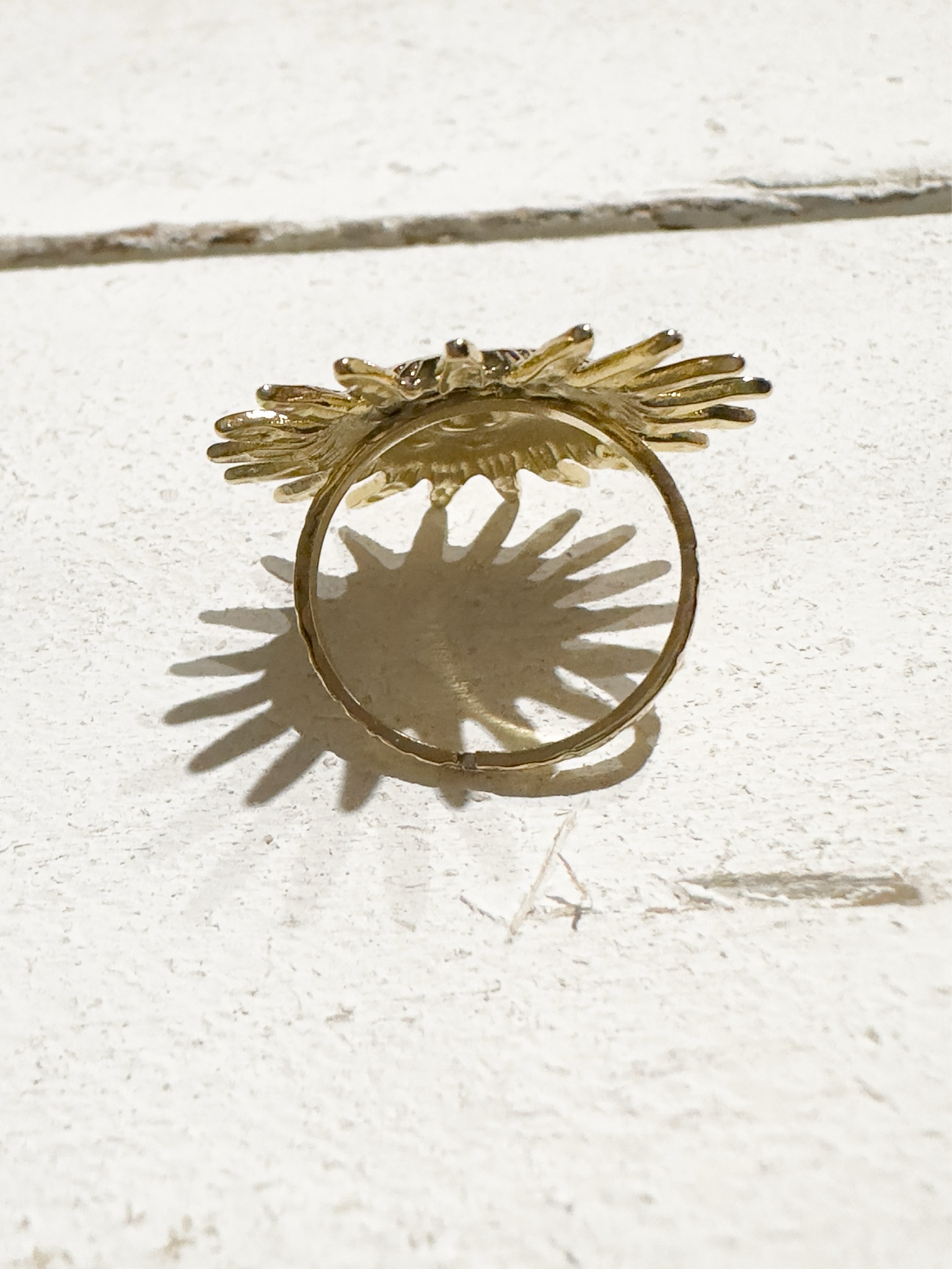 Anillo acero dorado sol