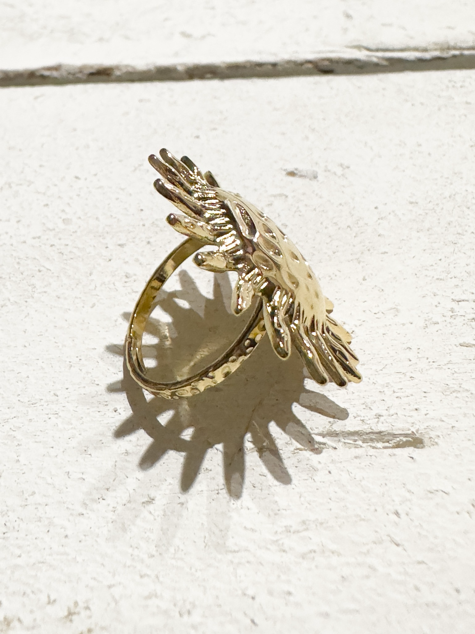Anillo acero dorado sol