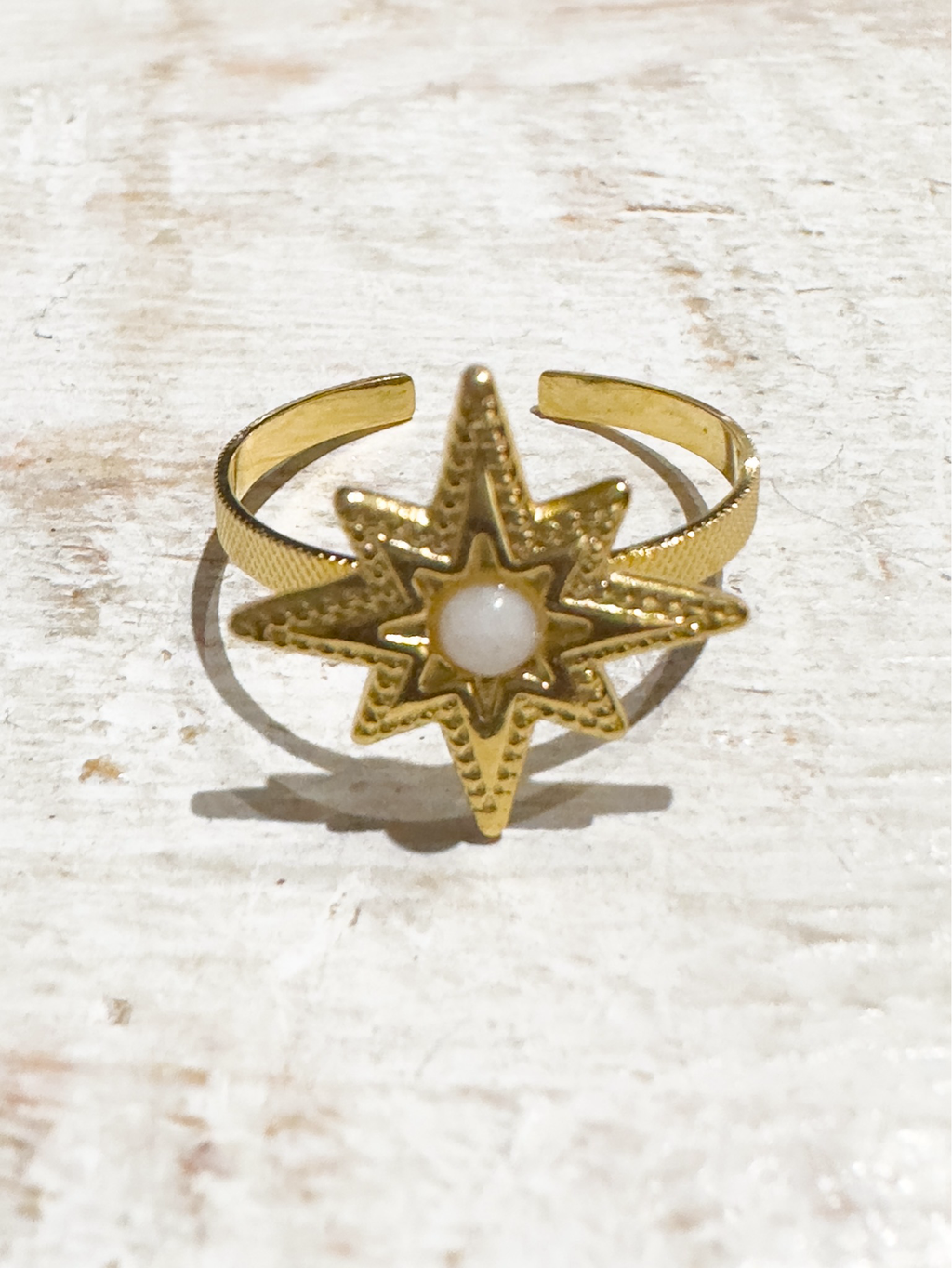 Anillo acero dorado estrella blanco