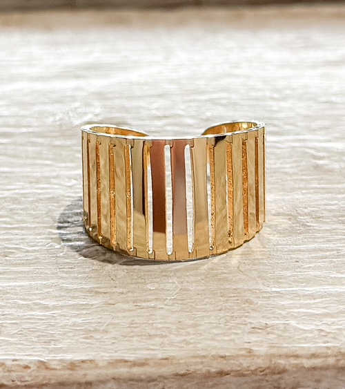 Anillo acero dorado barrotes