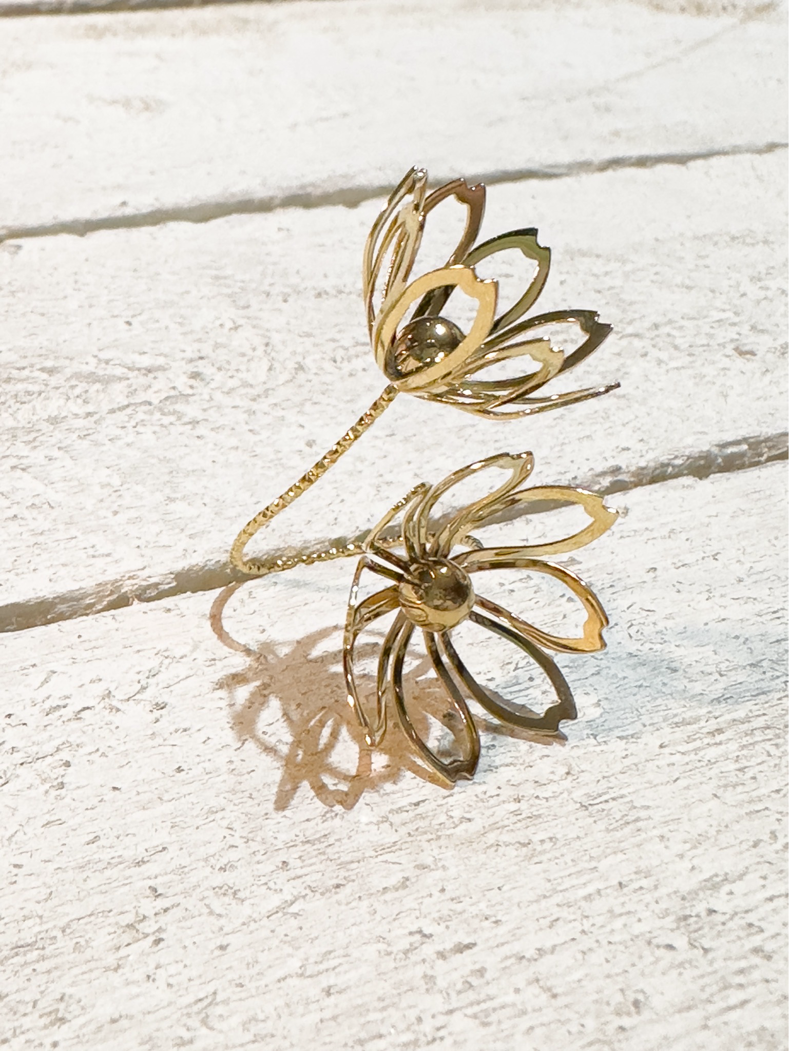 Anillo acero dorado doble flor