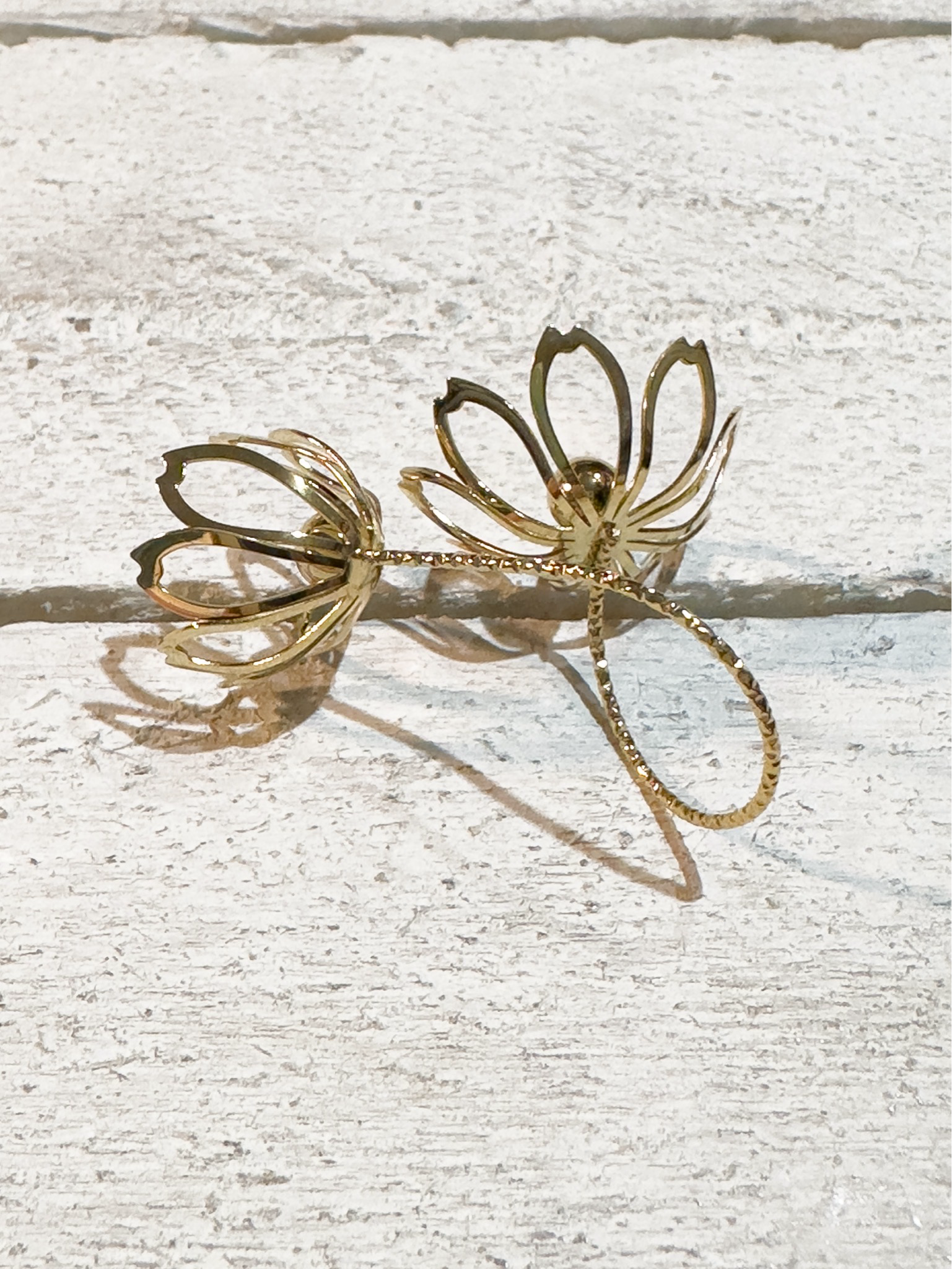 Anillo acero dorado doble flor