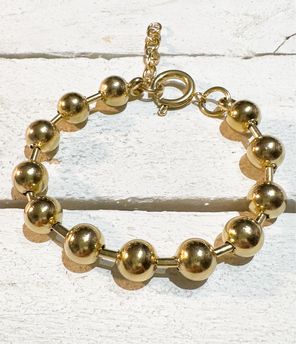 Pulsera acero dorado bolas