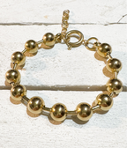 Pulsera acero dorado bolas