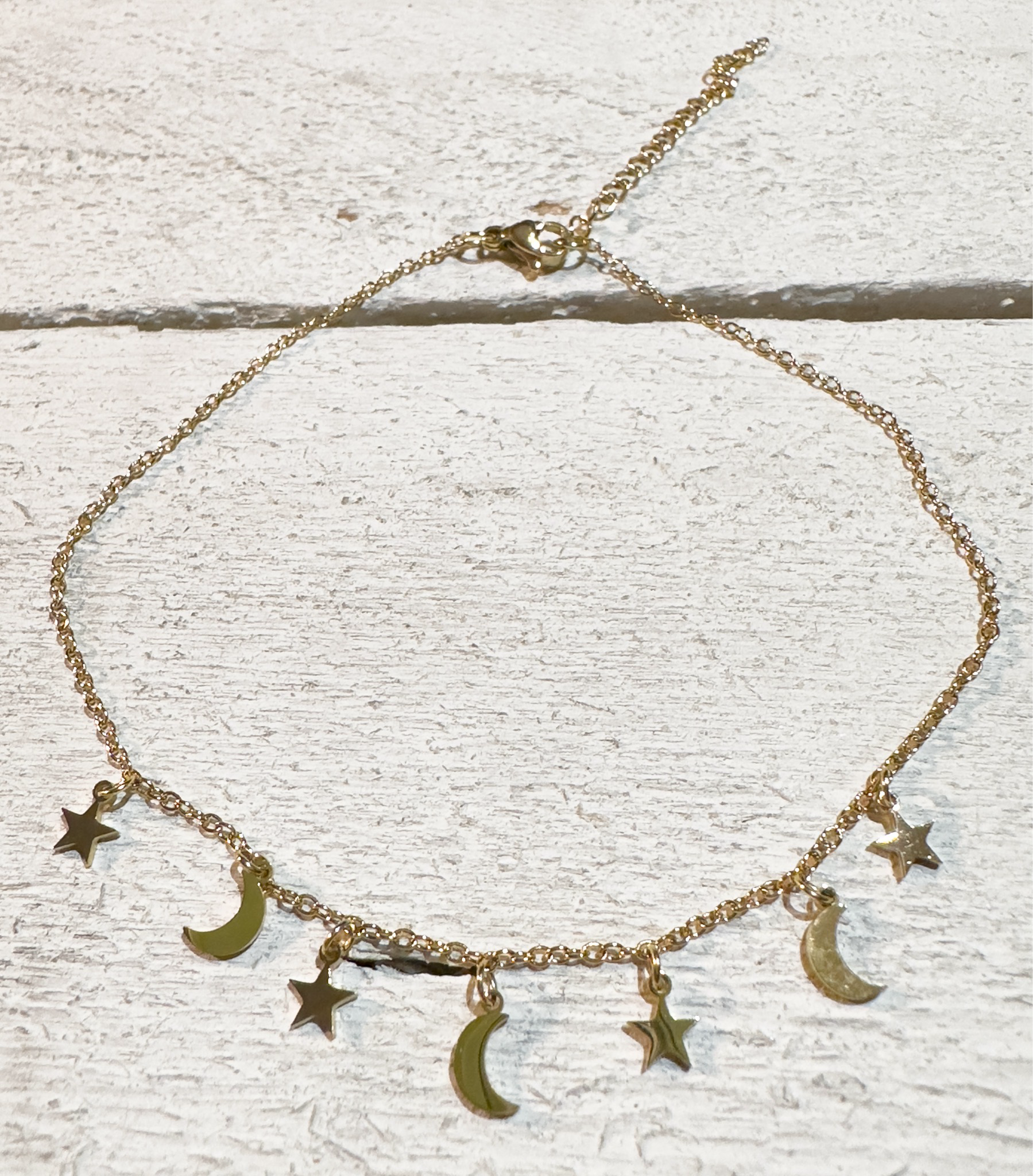 Tobillera acero dorado lunas y estrellas