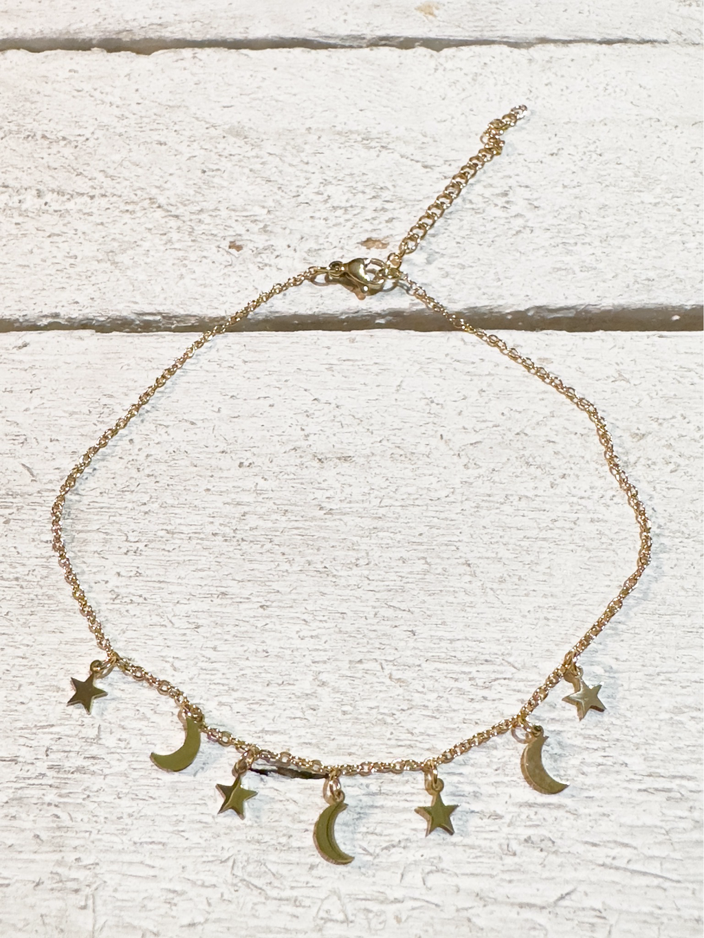 Tobillera acero dorado lunas y estrellas