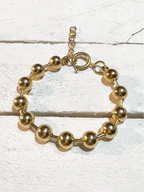 Pulsera acero dorado bolas