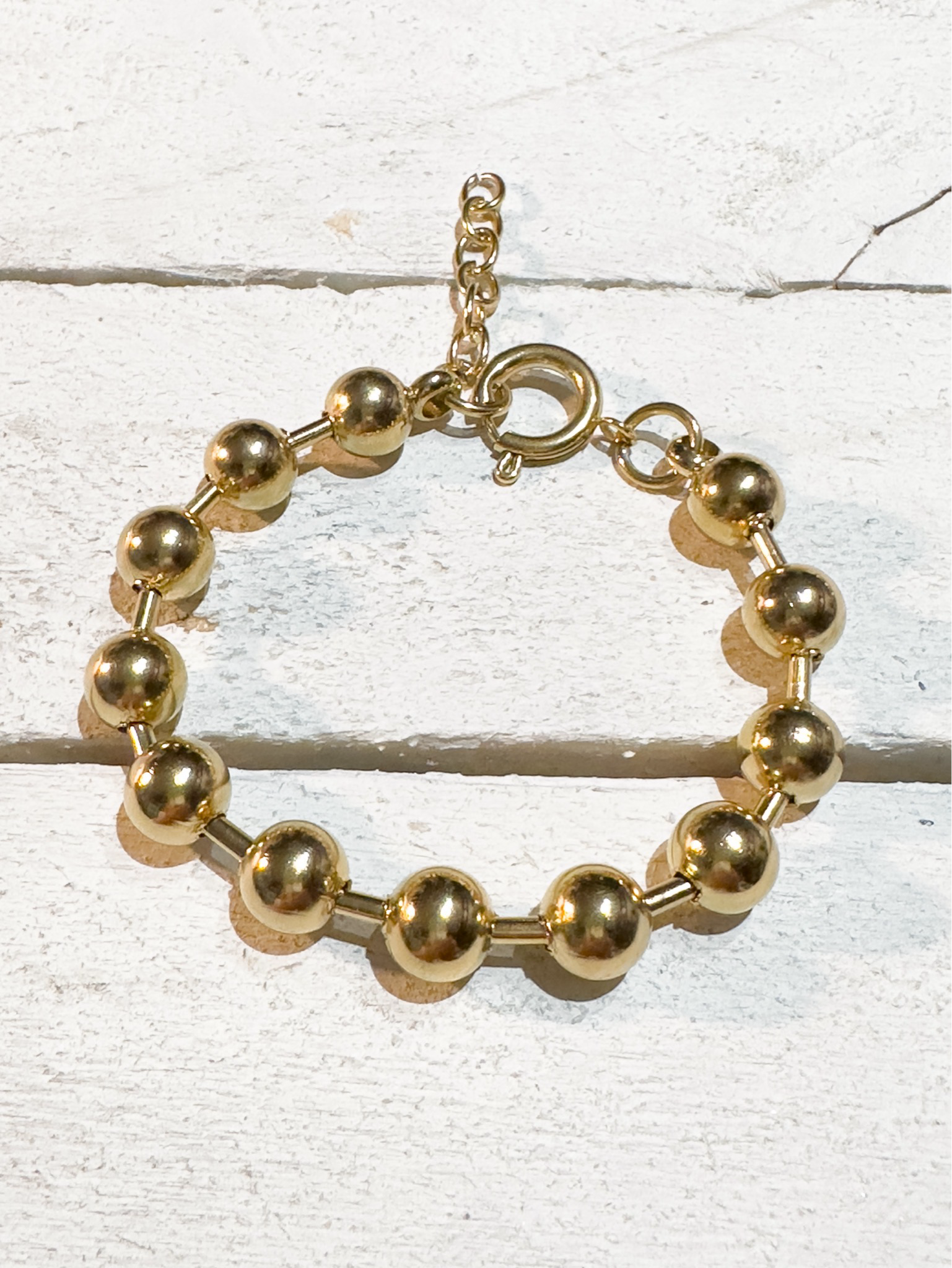 Pulsera acero dorado bolas