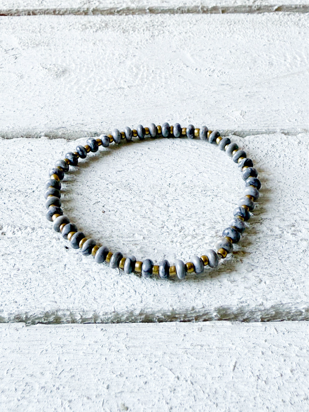 Pulsera piedra plana gris