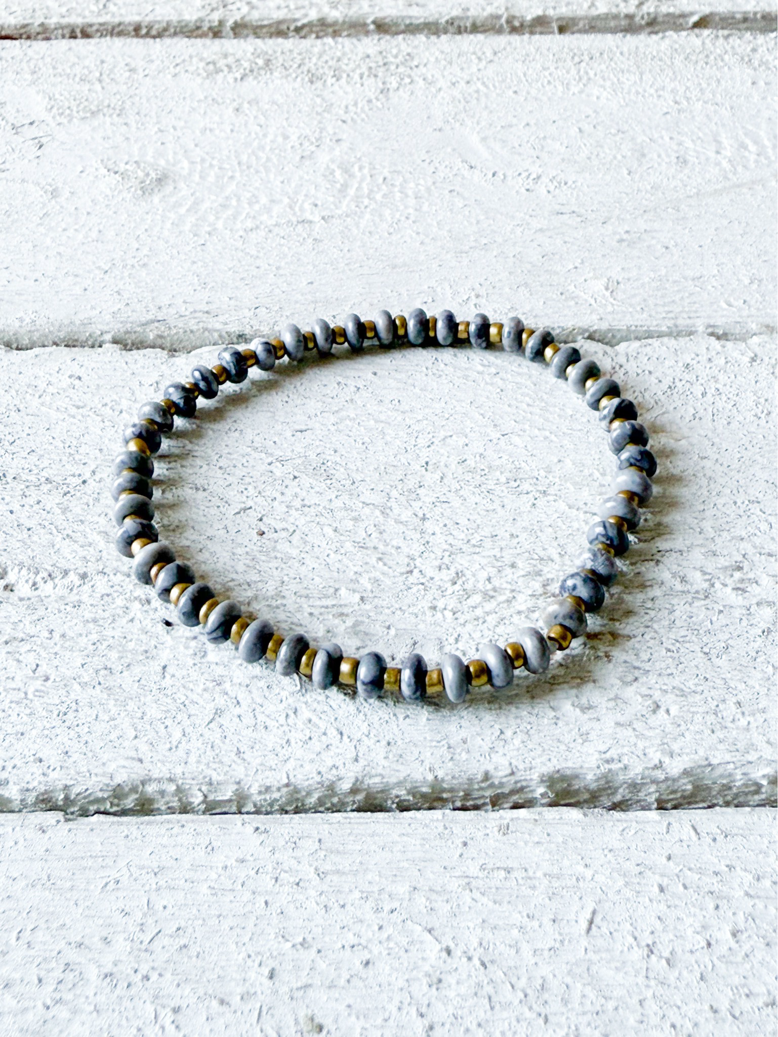 Pulsera piedra plana gris