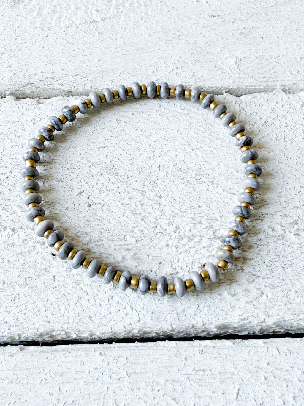 Pulsera piedra plana gris