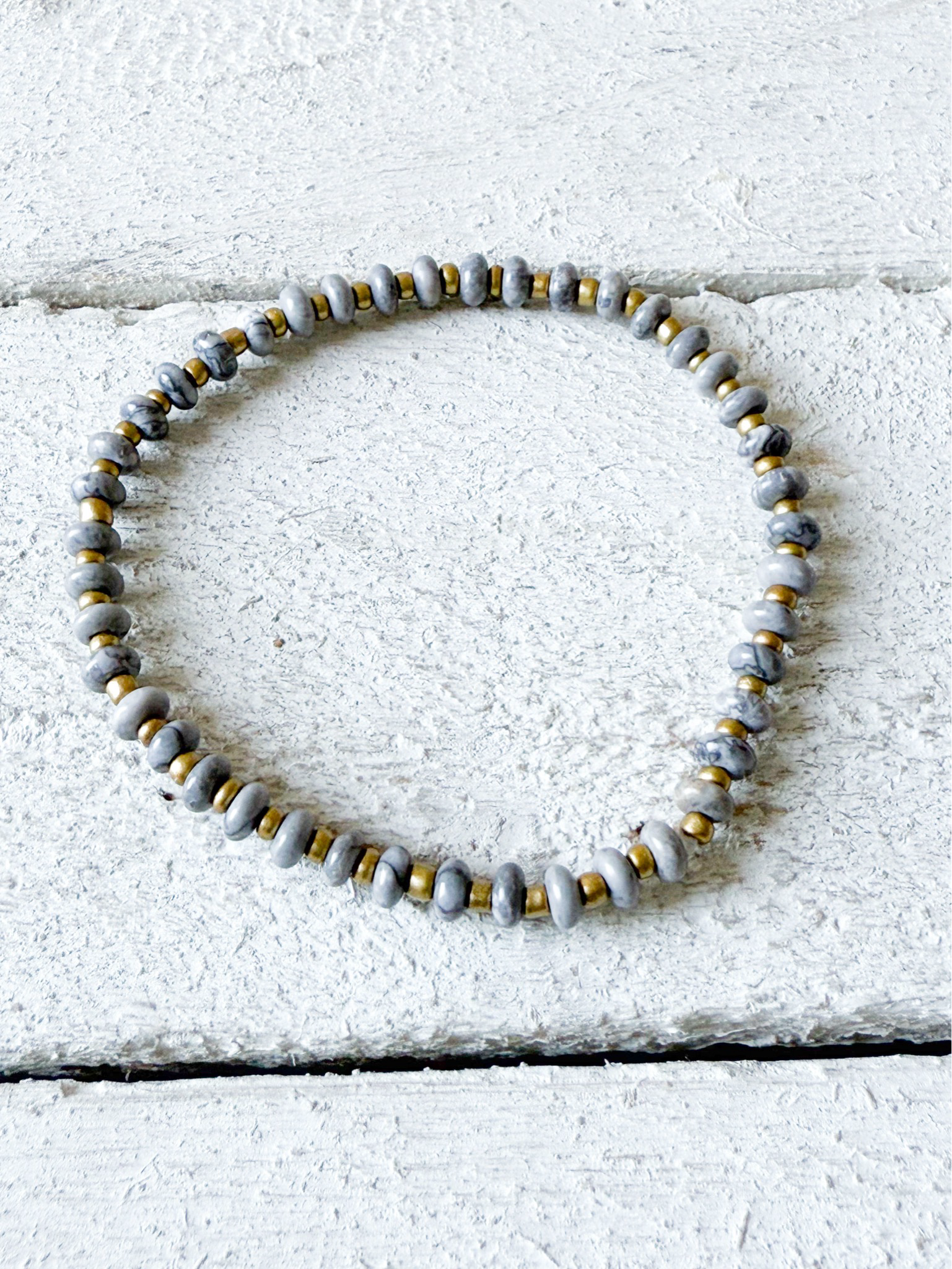 Pulsera piedra plana gris