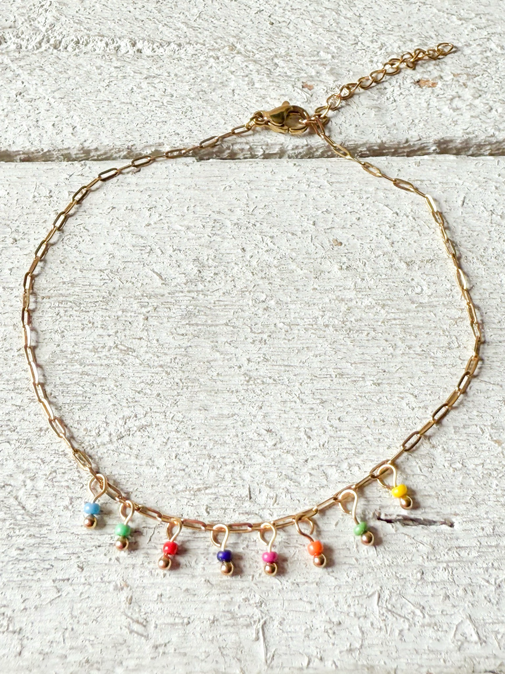Tobillera bolitas colores colgantes