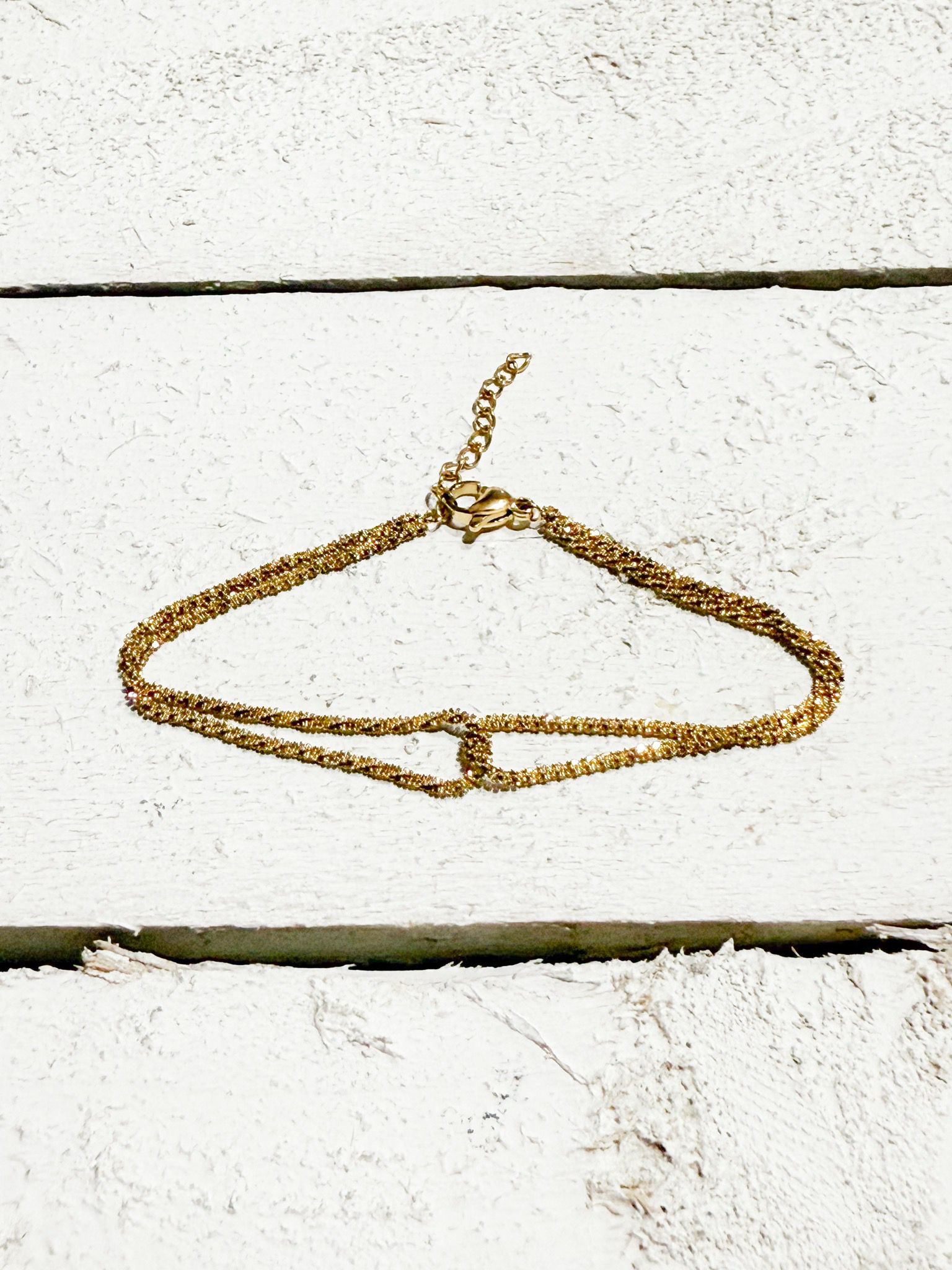 Pulsera cruzada dorada