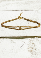 Pulsera cruzada dorada