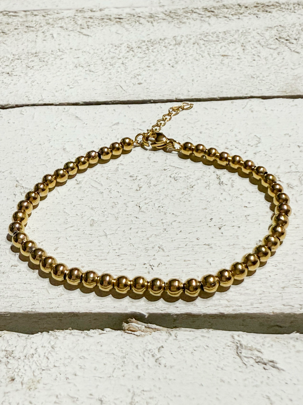 Pulsera bolitas doradas acero