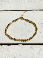 Pulsera bolitas doradas acero