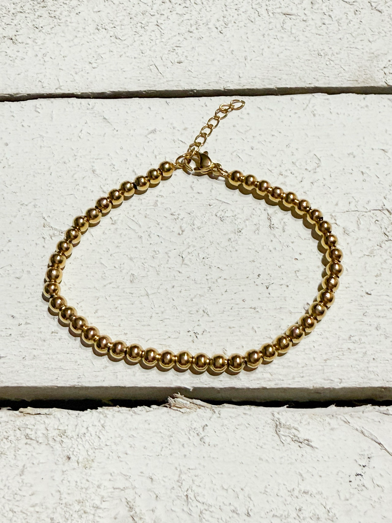 Pulsera bolitas doradas acero