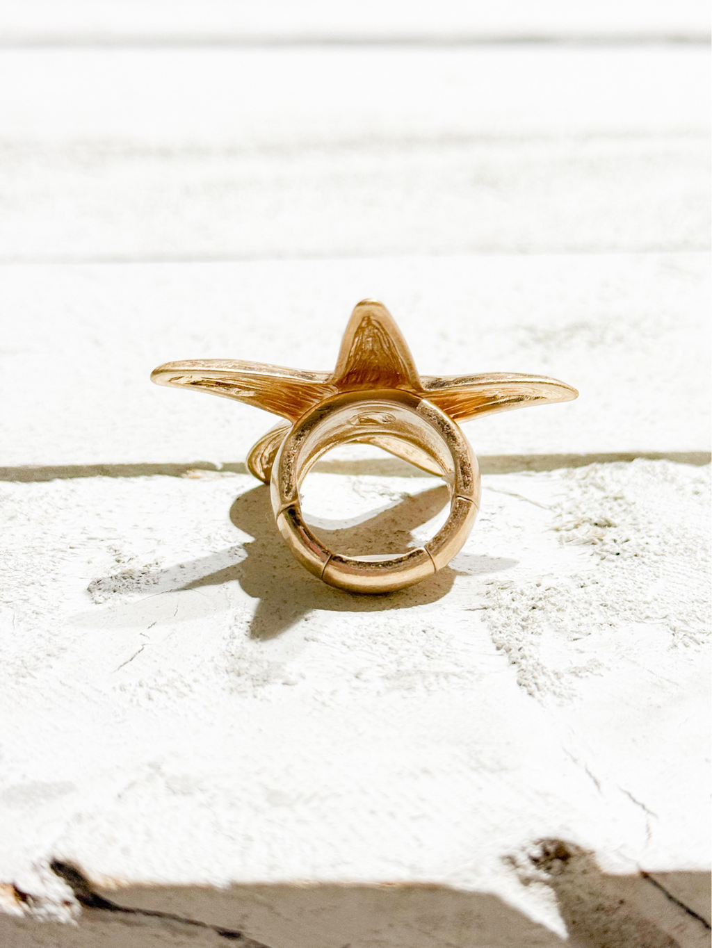 Anillo estrella dorado elástico