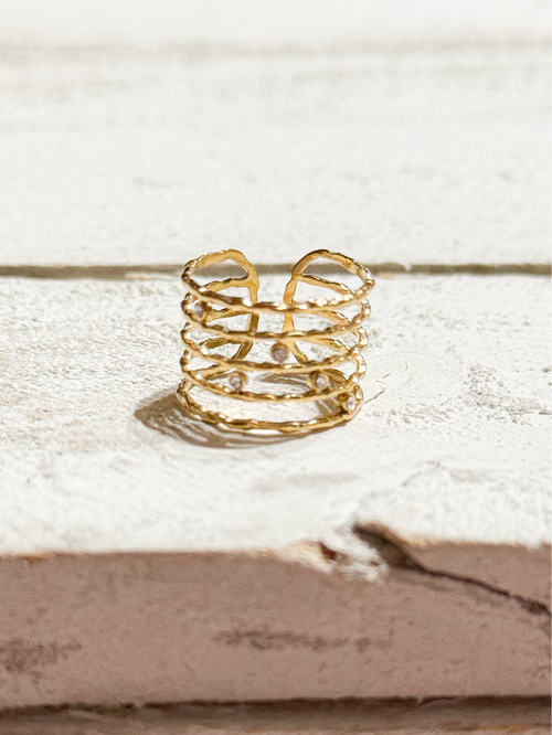 Anillo acero dorado baño cinco vueltas circonitas