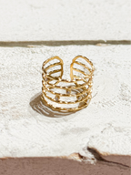 Anillo acero dorado baño cinco vueltas circonitas