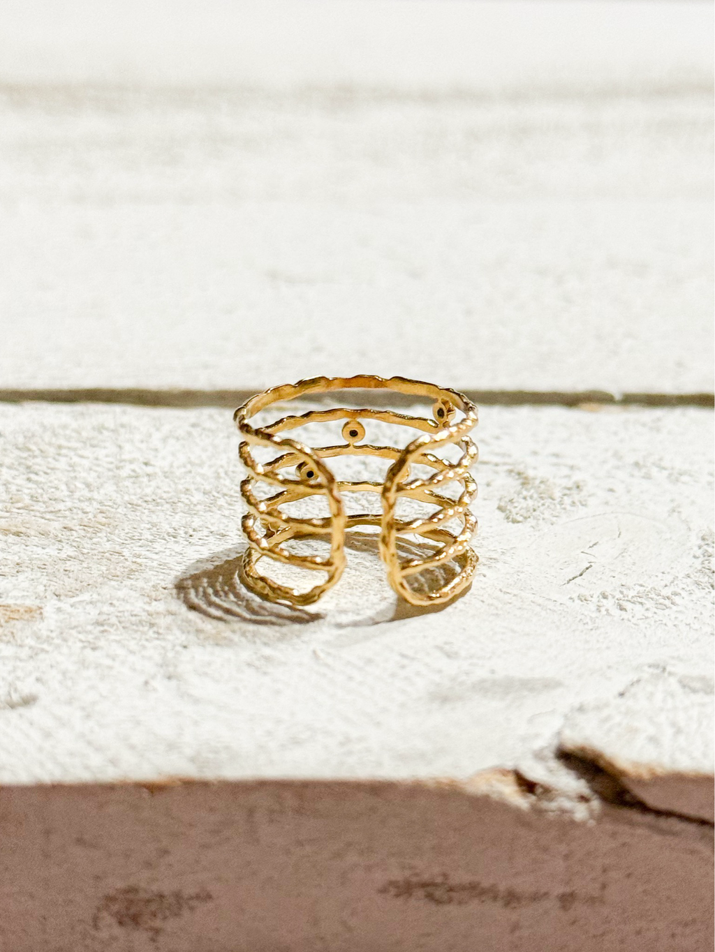 Anillo acero dorado baño cinco vueltas circonitas