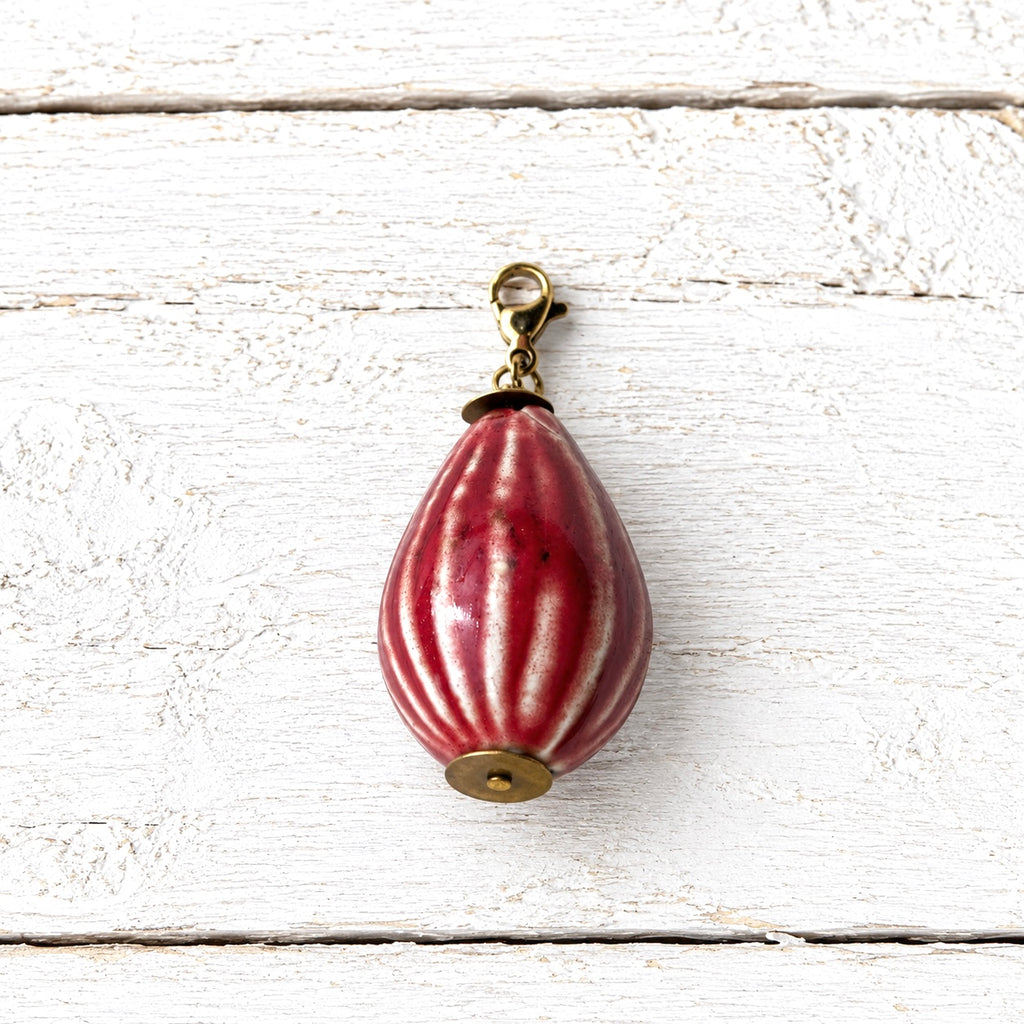 Charm peonza cerámica rojo