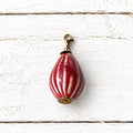 Charm peonza cerámica rojo