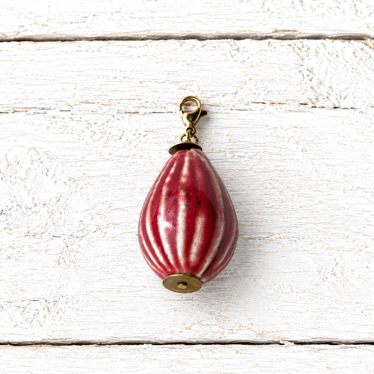 Charm peonza cerámica rojo