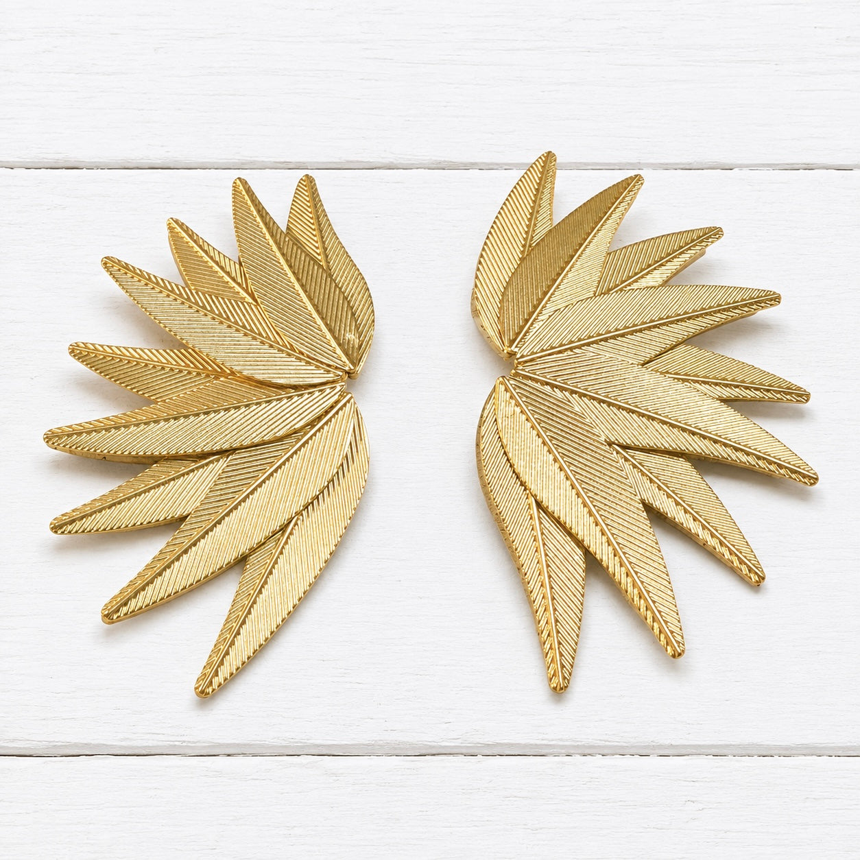 Pendientes nueve hojas metal dorado