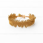 Pulsera miyuki flecos dorada