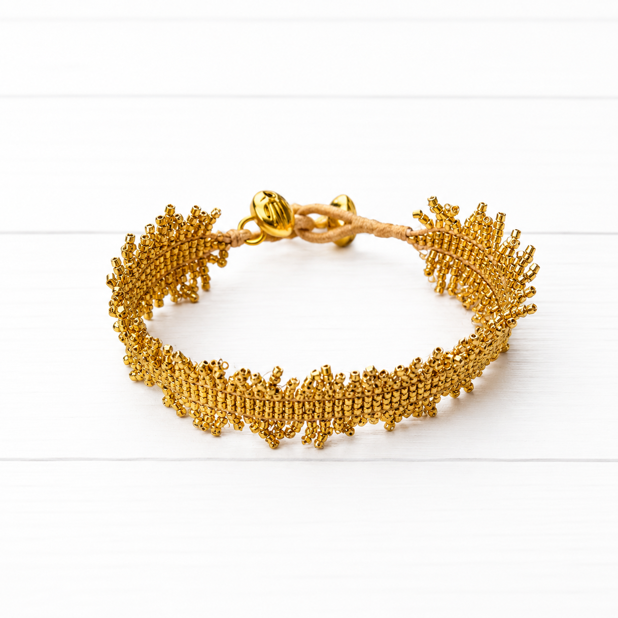 Pulsera miyuki flecos dorada