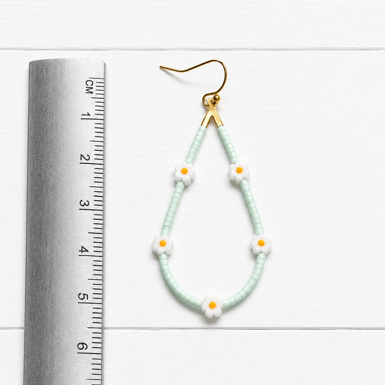 Pendientes gota margaritas agua