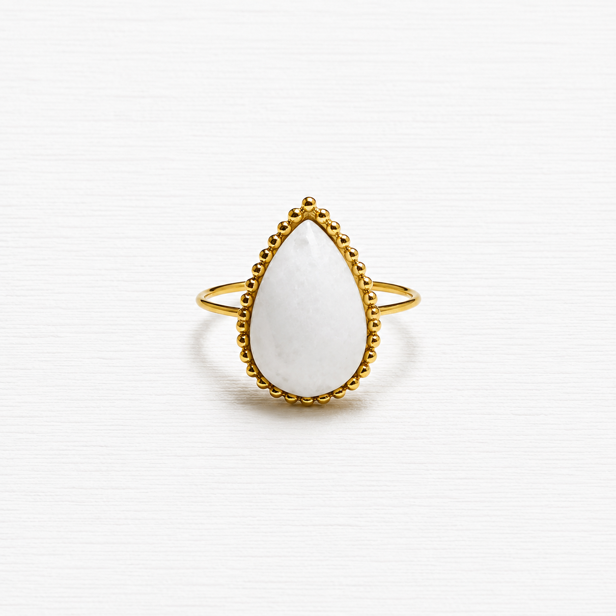 Anillo gota piedra blanca facetada