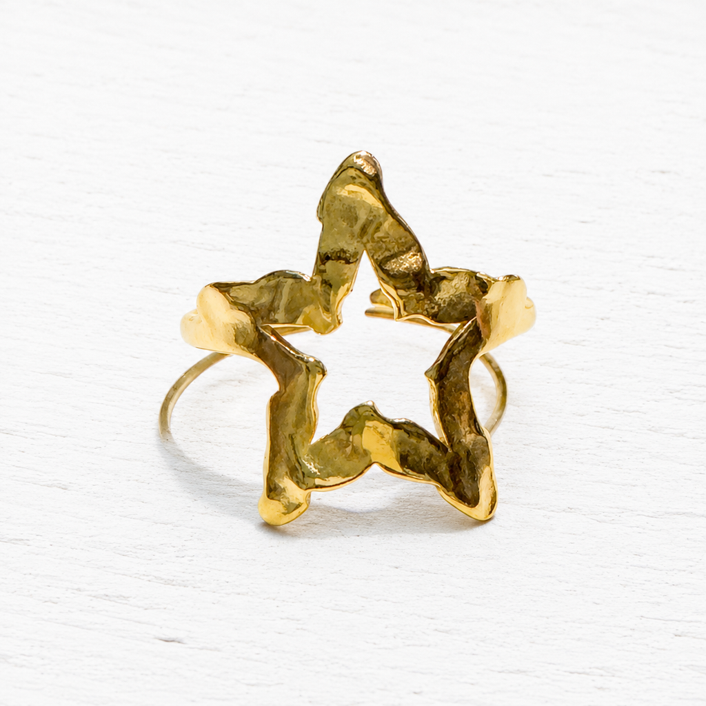 Anillo acero dorado estrella hueca