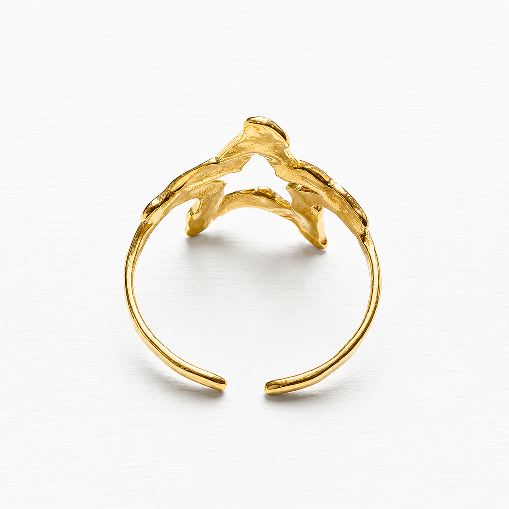 Anillo acero dorado estrella hueca