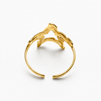 Anillo acero dorado estrella hueca