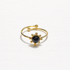 Anillo acero dorado sol piedra negra