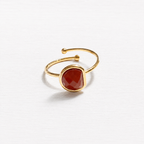 Anillo acero dorado semicírculo piedra facetada teja