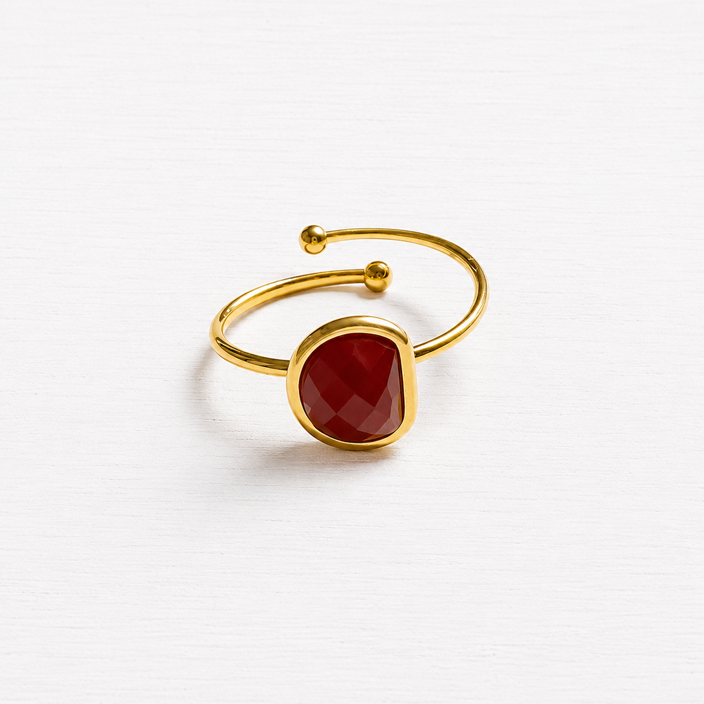 Anillo acero dorado semicírculo piedra facetada teja