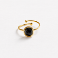 Anillo acero dorado semicírculo piedra facetada negra