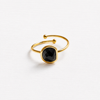 Anillo acero dorado semicírculo piedra facetada negra