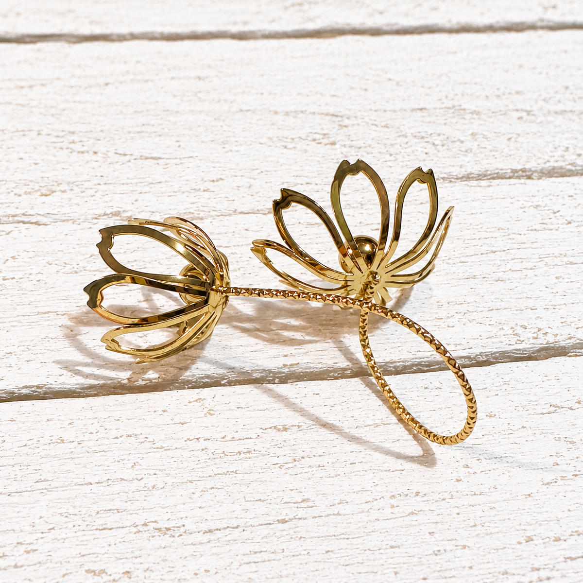 Anillo acero dorado doble flor