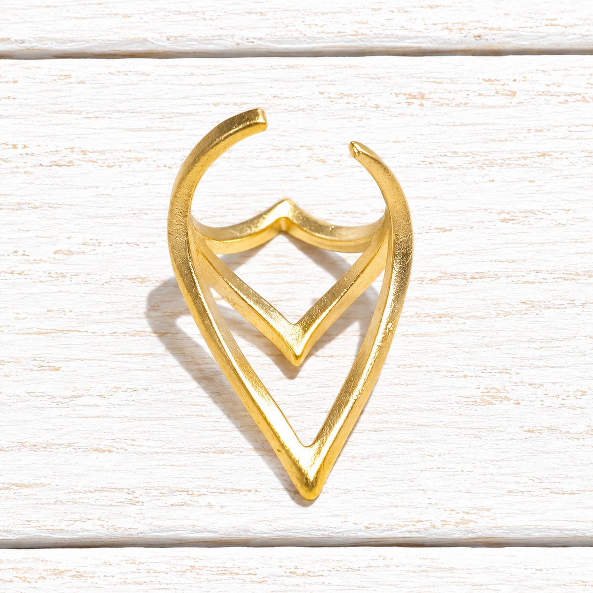 Anillo zamack dorado picos