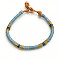 Pulsera cuero dorado azul y plomo