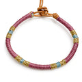 Pulsera cuero dorado berenjena
